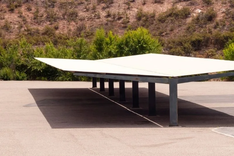 A carport in an open field