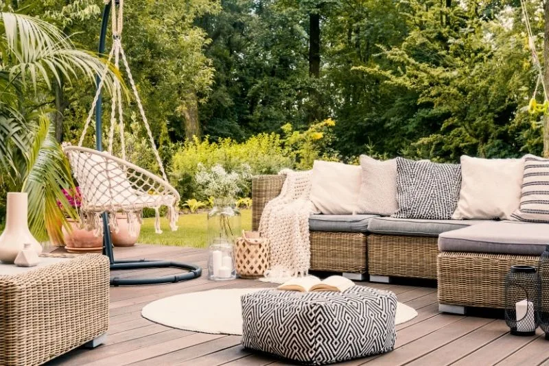 A patio with a swing