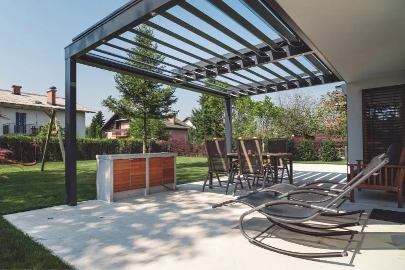 A pergola attached to a house